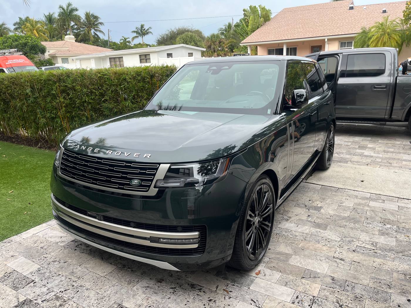 Dark green Range Rover after full mobile detail, driveway service
